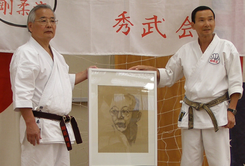 Masashi Sudo and Kenshu Watanabe with a portrait of Sosui Ichikawa